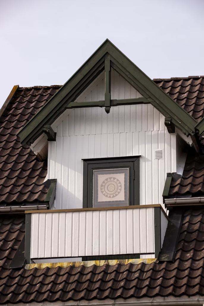 House roof with new gutters and downspouts